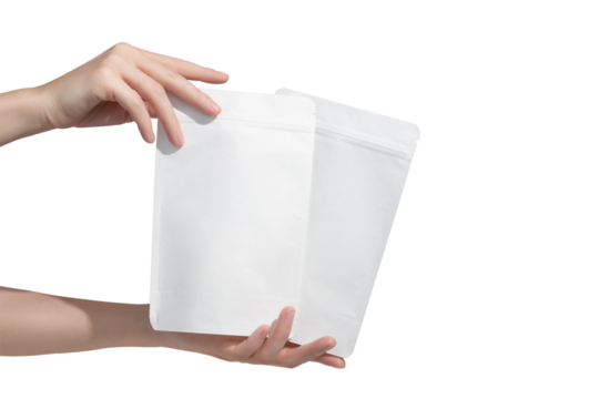 Woman's hands hold cardboard packages for tea or snacks on a transparent background. Tea branding and packaging mockup.