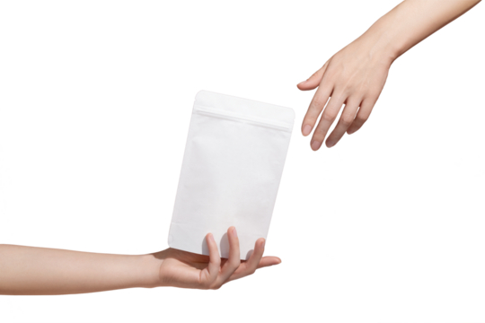 Female hand holds white cardboard packaging for tea/coffee/snack on transparent background. Branding and packaging mockup