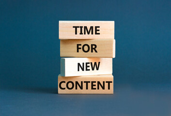Time for new content symbol. Concept words Time for new content on wooden blocks. Beautiful grey table grey background. Business time for new content concept. Copy space.
