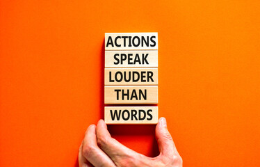 Naklejka na ściany i meble Actions speak louder words symbol. Concept words Actions speak louder than words on wooden blocks. Beautiful orange table orange background. Business new mindset for results concept. Copy space.