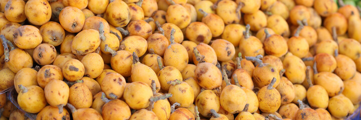 Lots of ripe fresh yellow ripe pears on market closeup