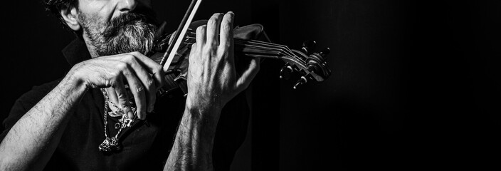 black and white photo of a fiddler