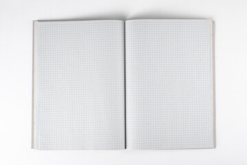 Open notebook on a white background. Top view. - obrazy, fototapety, plakaty