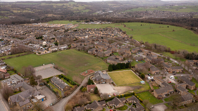 Aerial drone photo of the Village of Netherton near Huddersfield, in the Kirklees metropolitan borough of West Yorkshire, England showing the residential houses in the winter time