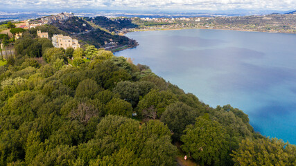 Aerial view of Lake Albano, a small volcanic crater lake in the Alban Hills of Lazio, south of Rome, Italy. Castel Gandolfo, overlooking the lake, is the site of the Papal Palace of Castel Gandolfo.