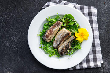 sardine salad freshgreen leaves  seafood snack meal food on the table copy space food background rustic top view  