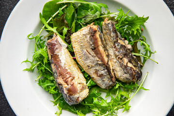 sardine salad freshgreen leaves  seafood snack meal food on the table copy space food background rustic top view  