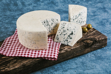 Cheese collection, piece of blue cheese made from cow milk close up - 576056395