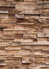 Brown, Tan, and Sand Toned Rough Textured Rock Wall Background.