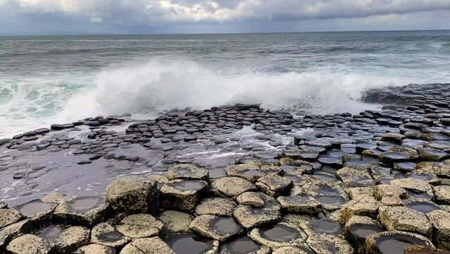 Giant's Causeway, area of interlocking basalt columns in Northern Ireland. Result of an ancient volcanic fissure eruption. The Causeway Coast natural wonder is managed by the National Trust.