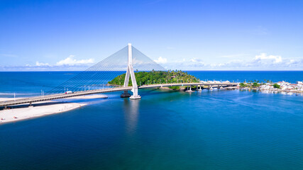 Fototapeta premium Aerial view of Ilheus, tourist town in Bahia. Historic city center with famous bridge in the background.