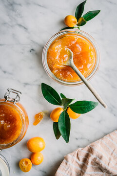 Glasses of kumquat jam with fruits