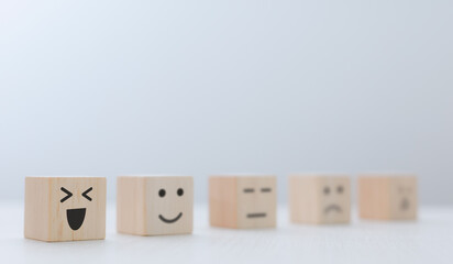 wooden blocks and icons represent satisfaction from service