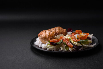 Delicious healthy breakfast consisting of chicken, rice, greens and cherry tomatoes