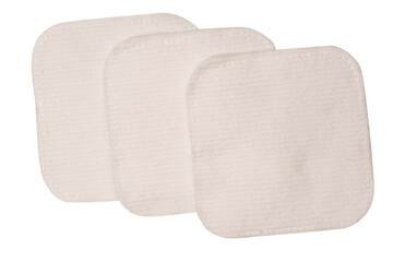 Stack of white cotton sponges isolated on a white background.