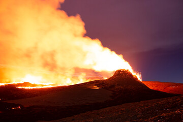 Volcanic valley bright eruption night landscape, Iceland