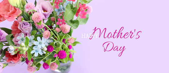 Fototapeta na wymiar mother's day concept with pink and purple flowers over pastel background