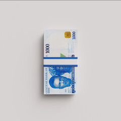 Pile of 1000 Naira notes isolated on white background.