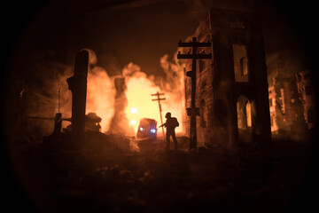 Empty street of burnt up city, flames on the ground and blasts with smoke in the distance....