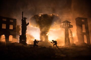 Conceptual image of war between Democracy and dictatorship using toy soldiers. Battle in ruined...