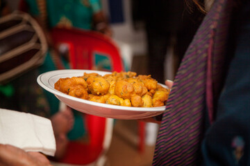 Deep fried cakes being served.