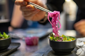 Chef cooking vegetables salad on restaurant kitchen