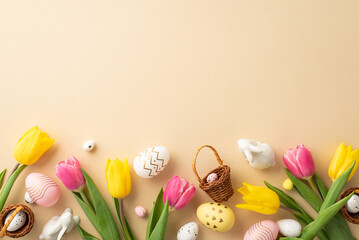 Easter celebration concept. Top view photo of colorful easter eggs small baskets ceramic bunnies yellow and pink tulips on isolated pastel beige background with copyspace