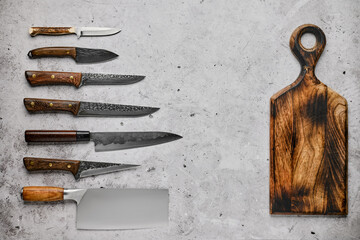 Different kinds of knives and cutting board