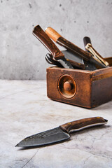 Wooden box with different types of knives