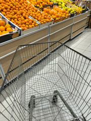 Shopping trolley in a fruit department supermarket