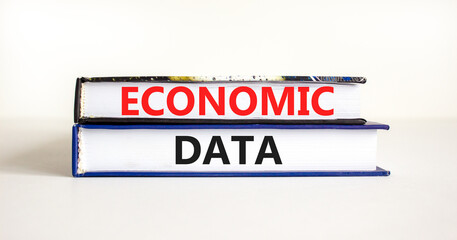 Economic data symbol. Concept words Economic data on books. Beautiful white table white background. Business economic data concept. Copy space.
