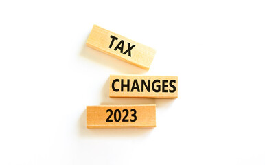 Tax changes 2023 symbol. Concept words Tax changes 2023 on wooden blocks on a beautiful white table white background. Business Tax changes 2023 concept. Copy space.