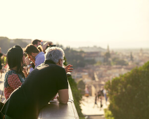 Tourists watching from the observation deck on the city of Florence
