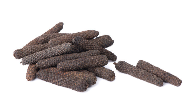 Dry Indian long pepper on a white background. Piper Longum. Piper retrofractum. Herbal medical plant concept.