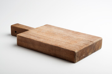 Rustic rectangular wooden cutting board isolated on white background