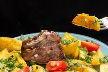 A plate of food with a piece of meat and vegetables.