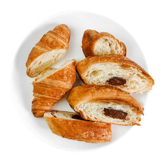 croissant chopped with  chocolate on a white plate on a transparent background top view side view