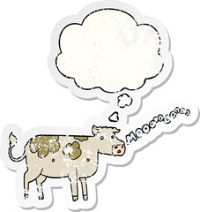 cartoon cow and thought bubble as a distressed worn sticker