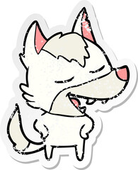 distressed sticker of a cartoon wolf laughing