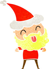 man with beard sticking out tongue wearing santa hat