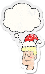 cartoon man wearing christmas hat and thought bubble as a distressed worn sticker