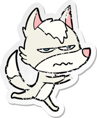 distressed sticker of a cartoon annoyed wolf