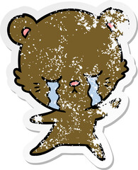 distressed sticker of a crying cartoon bear