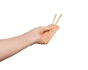 Bamboo sticks for sushi in male hand, isolate