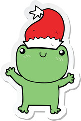 sticker of a cute cartoon frog wearing christmas hat