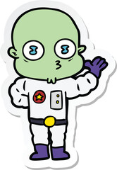 sticker of a waving weird bald spaceman