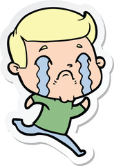 sticker of a cartoon man crying