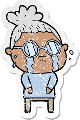 distressed sticker of a cartoon crying woman wearing spectacles