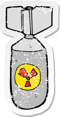 retro distressed sticker of a cartoon nuclear bomb