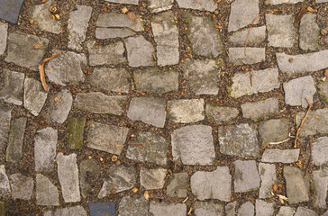 Abstract background of old cobblestone close up.